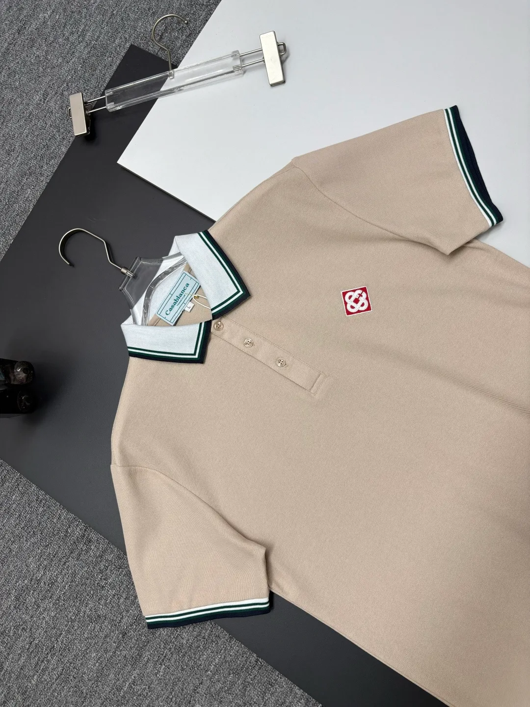 CASABLANCA New Arrival embroidered Polo shirt, original fabric, official Same Style, made of pure cotton pique fabric, customized vat-dyed fabric, feels very comfortable and smooth, very wide and stylish, produced by the first-line brand Factory, imported Behringer embroidery machine, embroidery is full and textured, collar and collar ribs are woven with imported yarn, does not deform after long-term wear, the latest New Arrival style in spring and summer, fashionable and individual Super Versatile, a good-looking one. It is very suitable for both men and women. It is a must-have for everyone. Color: Black White, Apricot, Blue Khaki Size: M-3XL